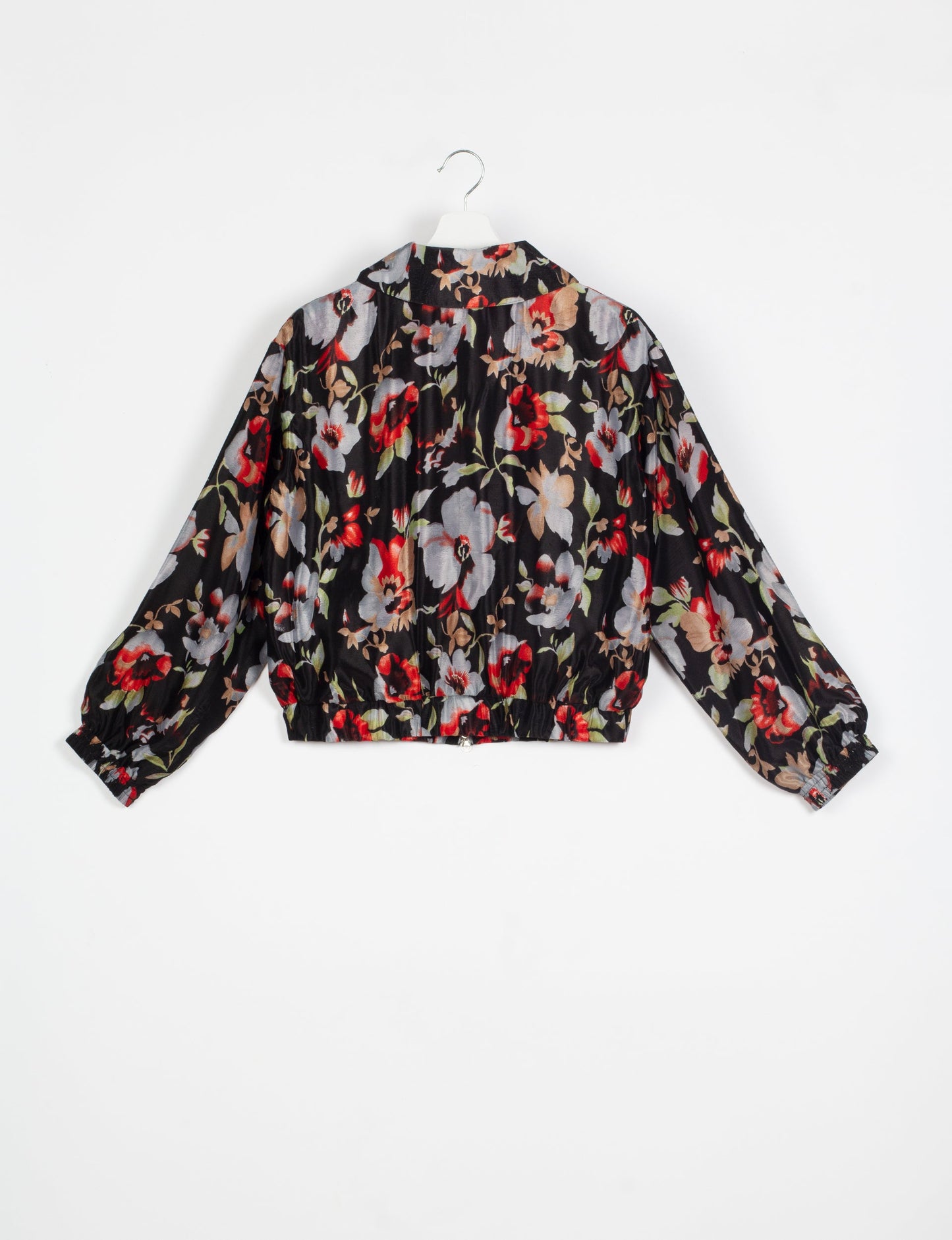 Stylish BOMBER JACKET, an upcycled clothing masterpiece with a cute cropped shape, elasticated details, and detachable metallic zipper. Contrast sari print lining adds a unique touch. Explore sustainable and eco-friendly fashion.