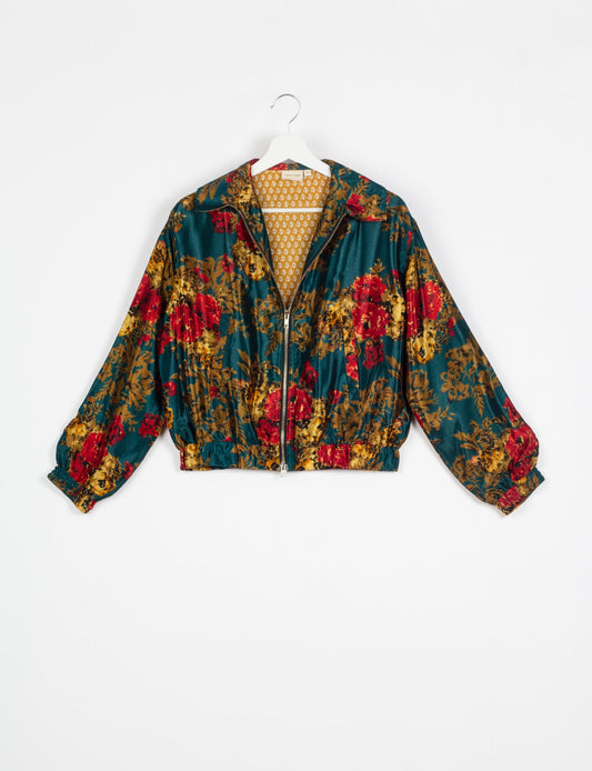 Stylish BOMBER JACKET, an upcycled clothing masterpiece with a cute cropped shape, elasticated details, and detachable metallic zipper. Contrast sari print lining adds a unique touch. Explore sustainable and eco-friendly fashion.