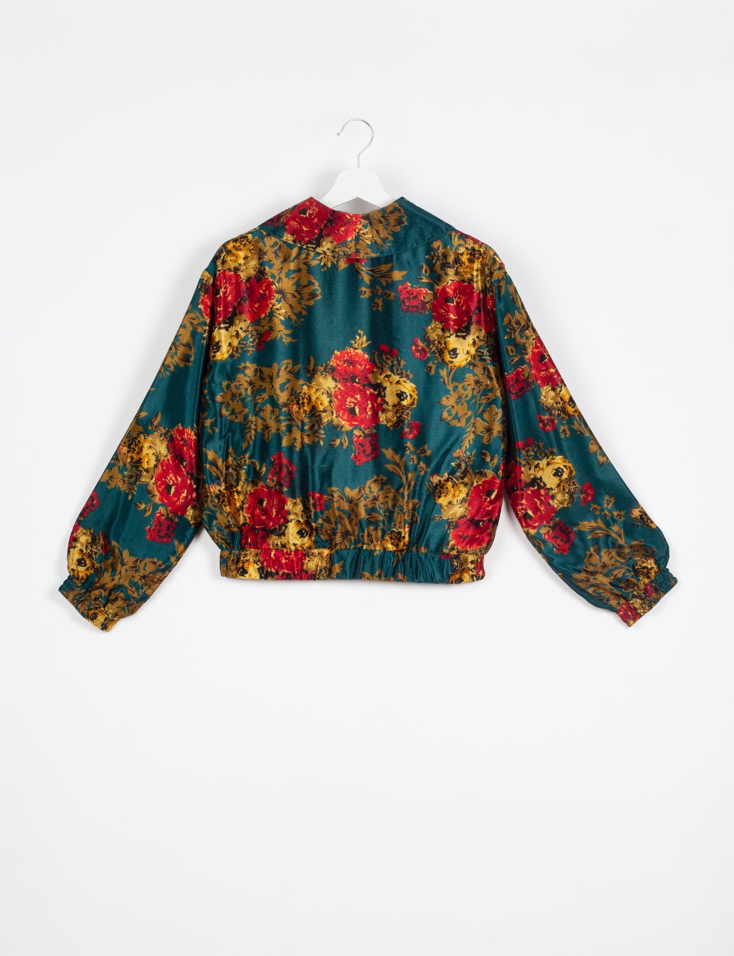 Stylish BOMBER JACKET, an upcycled clothing masterpiece with a cute cropped shape, elasticated details, and detachable metallic zipper. Contrast sari print lining adds a unique touch. Explore sustainable and eco-friendly fashion.