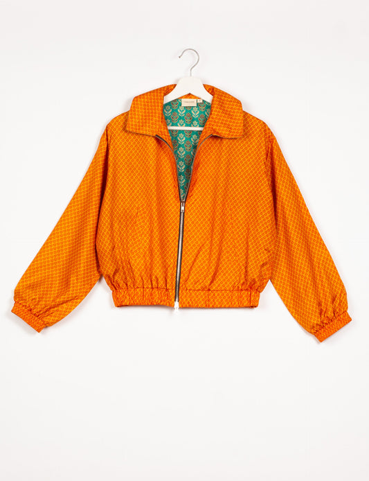 Stylish BOMBER JACKET, an upcycled clothing masterpiece with a cute cropped shape, elasticated details, and detachable metallic zipper. Contrast sari print lining adds a unique touch. Explore sustainable and eco-friendly fashion.