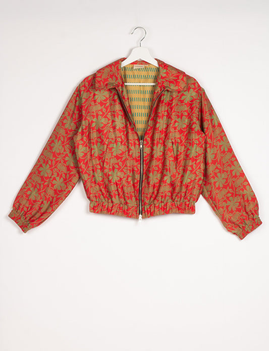 Stylish BOMBER JACKET, an upcycled clothing masterpiece with a cute cropped shape, elasticated details, and detachable metallic zipper. Contrast sari print lining adds a unique touch. Explore sustainable and eco-friendly fashion.