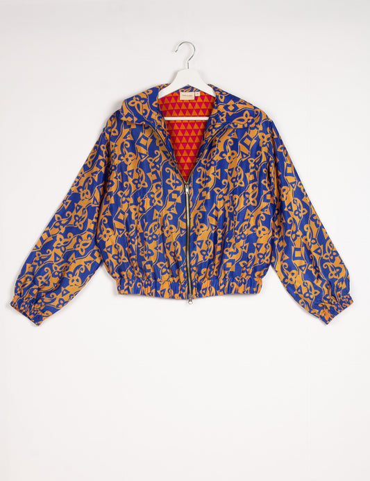 Stylish BOMBER JACKET, an upcycled clothing masterpiece with a cute cropped shape, elasticated details, and detachable metallic zipper. Contrast sari print lining adds a unique touch. Explore sustainable and eco-friendly fashion.