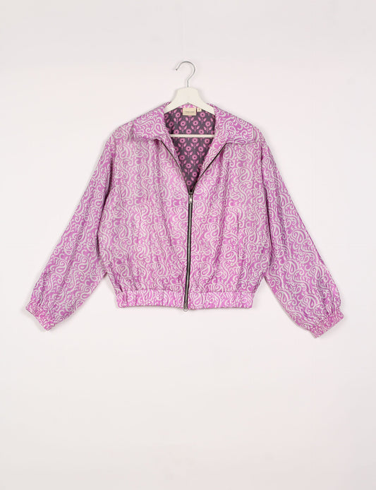 Stylish BOMBER JACKET, an upcycled clothing masterpiece with a cute cropped shape, elasticated details, and detachable metallic zipper. Contrast sari print lining adds a unique touch. Explore sustainable and eco-friendly fashion.