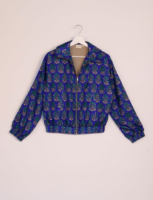 Stylish BOMBER JACKET, an upcycled clothing masterpiece with a cute cropped shape, elasticated details, and detachable metallic zipper. Contrast sari print lining adds a unique touch. Explore sustainable and eco-friendly fashion.