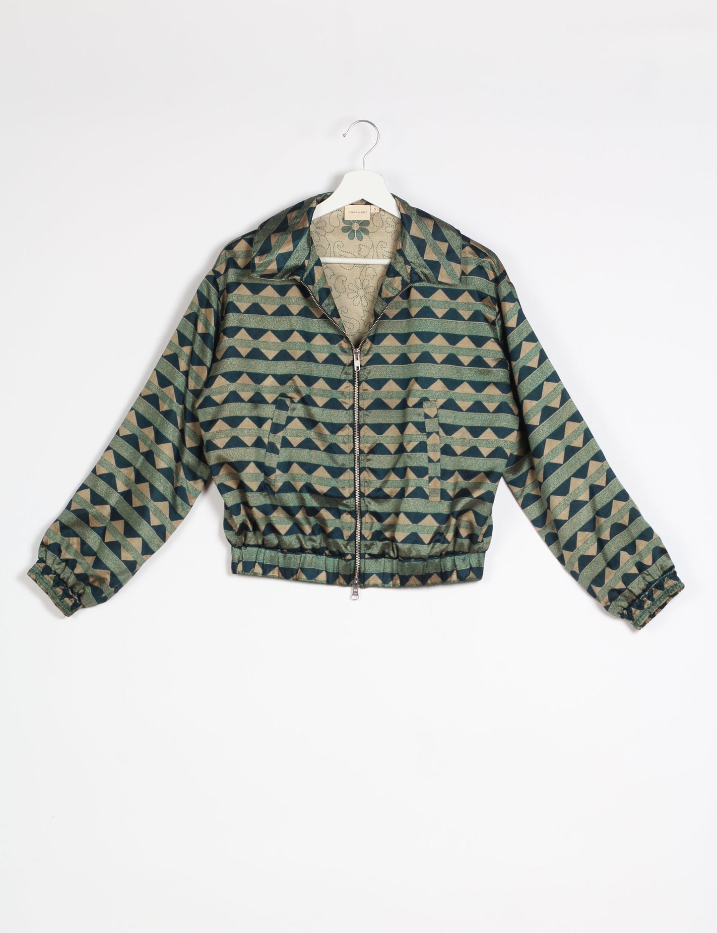 Stylish BOMBER JACKET, an upcycled clothing masterpiece with a cute cropped shape, elasticated details, and detachable metallic zipper. Contrast sari print lining adds a unique touch. Explore sustainable and eco-friendly fashion.