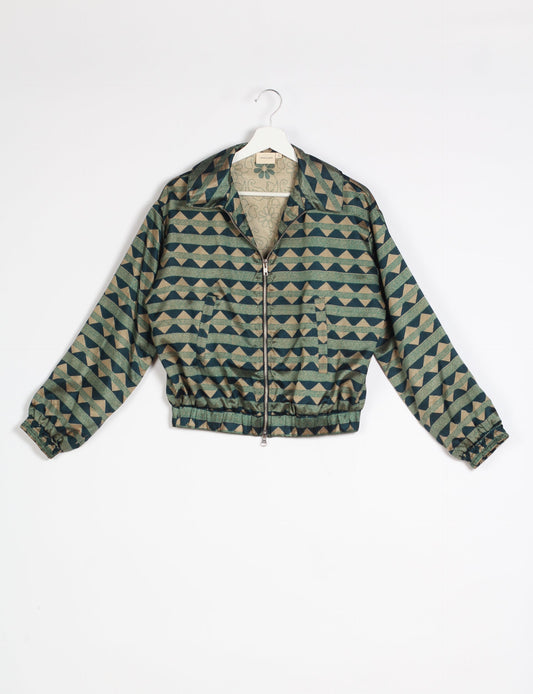 Stylish BOMBER JACKET, an upcycled clothing masterpiece with a cute cropped shape, elasticated details, and detachable metallic zipper. Contrast sari print lining adds a unique touch. Explore sustainable and eco-friendly fashion.