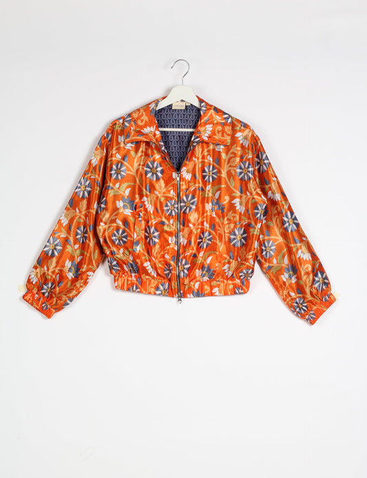 Stylish BOMBER JACKET, an upcycled clothing masterpiece with a cute cropped shape, elasticated details, and detachable metallic zipper. Contrast sari print lining adds a unique touch. Explore sustainable and eco-friendly fashion.