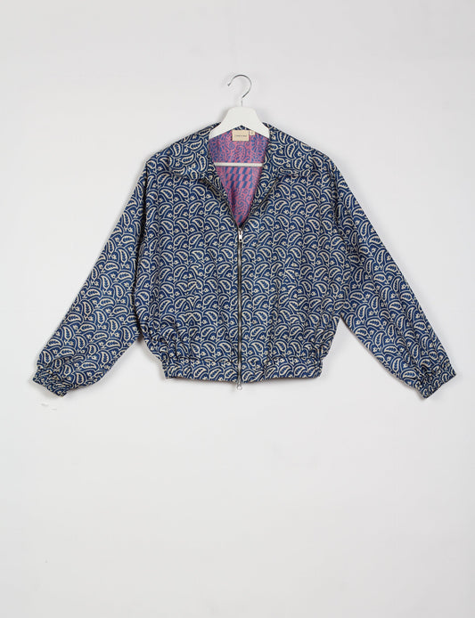 Stylish BOMBER JACKET, an upcycled clothing masterpiece with a cute cropped shape, elasticated details, and detachable metallic zipper. Contrast sari print lining adds a unique touch. Explore sustainable and eco-friendly fashion.