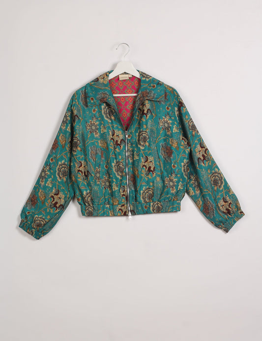 Stylish BOMBER JACKET, an upcycled clothing masterpiece with a cute cropped shape, elasticated details, and detachable metallic zipper. Contrast sari print lining adds a unique touch. Explore sustainable and eco-friendly fashion.