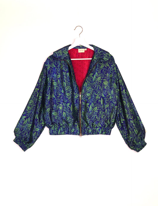 Stylish BOMBER JACKET, an upcycled clothing masterpiece with a cute cropped shape, elasticated details, and detachable metallic zipper. Contrast sari print lining adds a unique touch. Explore sustainable and eco-friendly fashion.