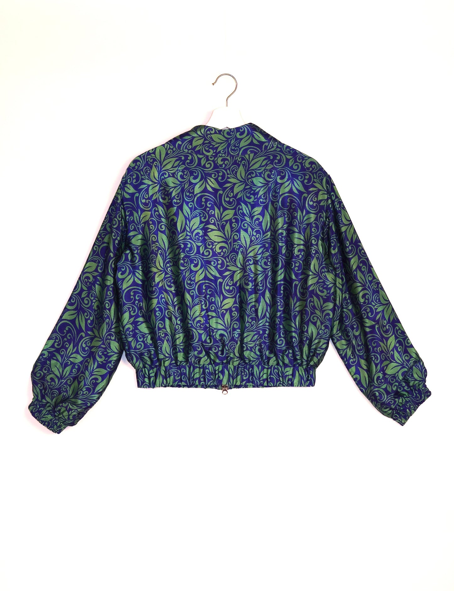 Stylish BOMBER JACKET, an upcycled clothing masterpiece with a cute cropped shape, elasticated details, and detachable metallic zipper. Contrast sari print lining adds a unique touch. Explore sustainable and eco-friendly fashion.