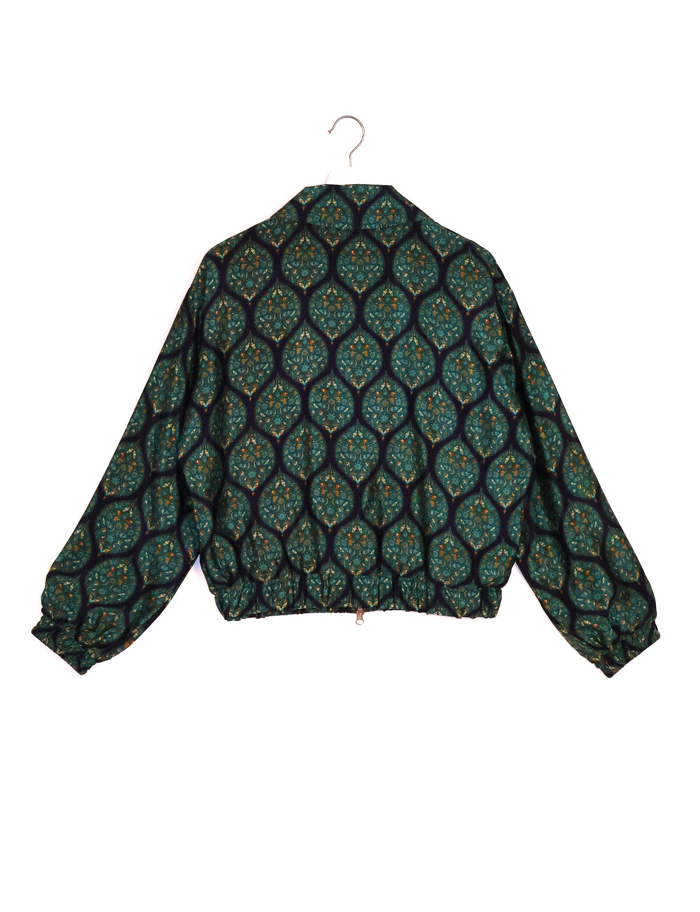 Stylish BOMBER JACKET, an upcycled clothing masterpiece with a cute cropped shape, elasticated details, and detachable metallic zipper. Contrast sari print lining adds a unique touch. Explore sustainable and eco-friendly fashion.