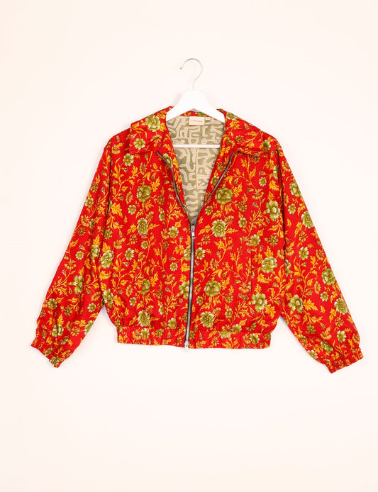 Stylish BOMBER JACKET, an upcycled clothing masterpiece with a cute cropped shape, elasticated details, and detachable metallic zipper. Contrast sari print lining adds a unique touch. Explore sustainable and eco-friendly fashion.