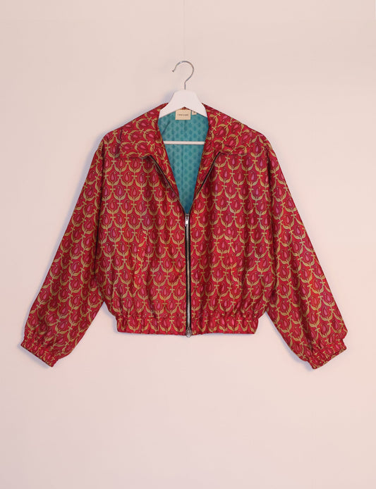 Stylish BOMBER JACKET, an upcycled clothing masterpiece with a cute cropped shape, elasticated details, and detachable metallic zipper. Contrast sari print lining adds a unique touch. Explore sustainable and eco-friendly fashion.