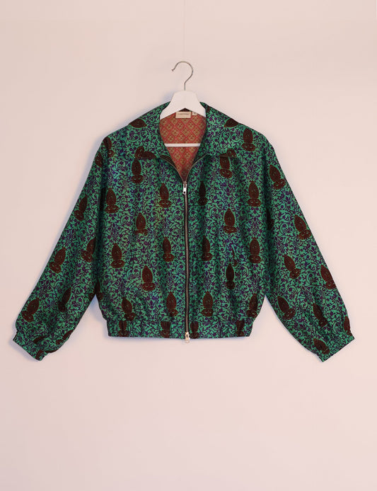 Stylish BOMBER JACKET, an upcycled clothing masterpiece with a cute cropped shape, elasticated details, and detachable metallic zipper. Contrast sari print lining adds a unique touch. Explore sustainable and eco-friendly fashion.