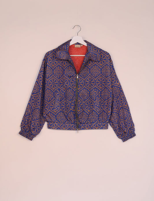 Stylish BOMBER JACKET, an upcycled clothing masterpiece with a cute cropped shape, elasticated details, and detachable metallic zipper. Contrast sari print lining adds a unique touch. Explore sustainable and eco-friendly fashion.