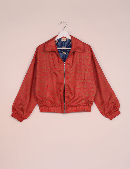 Stylish BOMBER JACKET, an upcycled clothing masterpiece with a cute cropped shape, elasticated details, and detachable metallic zipper. Contrast sari print lining adds a unique touch. Explore sustainable and eco-friendly fashion.