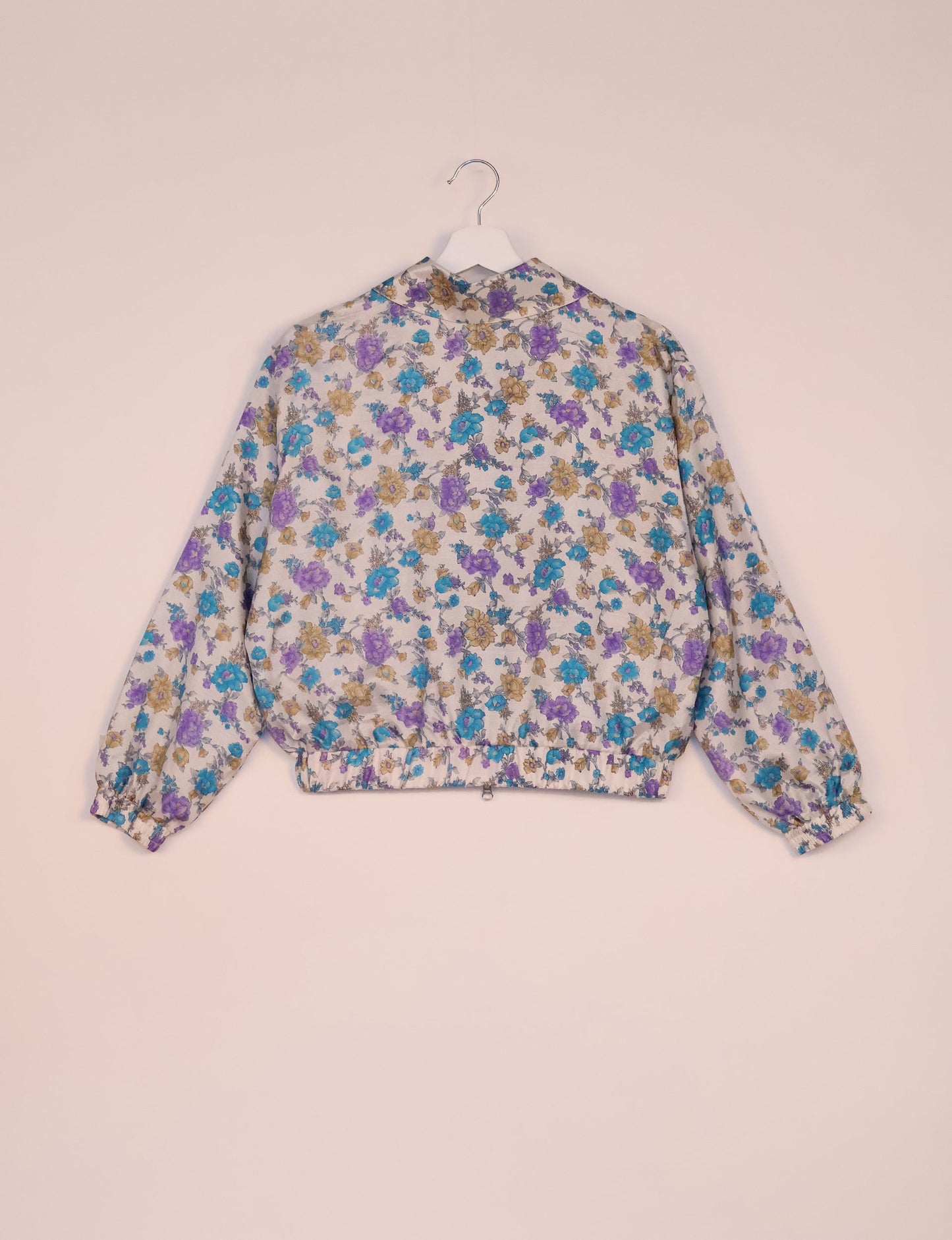 Stylish BOMBER JACKET, an upcycled clothing masterpiece with a cute cropped shape, elasticated details, and detachable metallic zipper. Contrast sari print lining adds a unique touch. Explore sustainable and eco-friendly fashion.