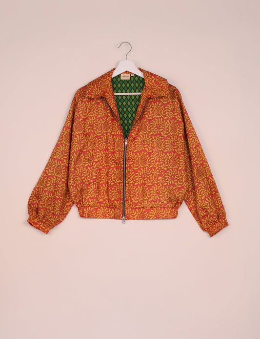 Stylish BOMBER JACKET, an upcycled clothing masterpiece with a cute cropped shape, elasticated details, and detachable metallic zipper. Contrast sari print lining adds a unique touch. Explore sustainable and eco-friendly fashion.