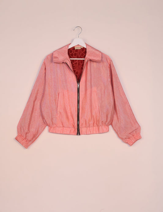 Stylish BOMBER JACKET, an upcycled clothing masterpiece with a cute cropped shape, elasticated details, and detachable metallic zipper. Contrast sari print lining adds a unique touch. Explore sustainable and eco-friendly fashion.