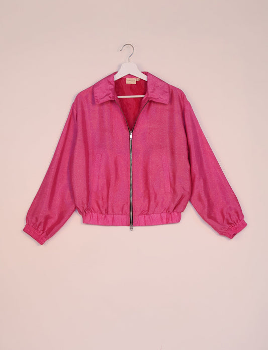 Stylish BOMBER JACKET, an upcycled clothing masterpiece with a cute cropped shape, elasticated details, and detachable metallic zipper. Contrast sari print lining adds a unique touch. Explore sustainable and eco-friendly fashion.