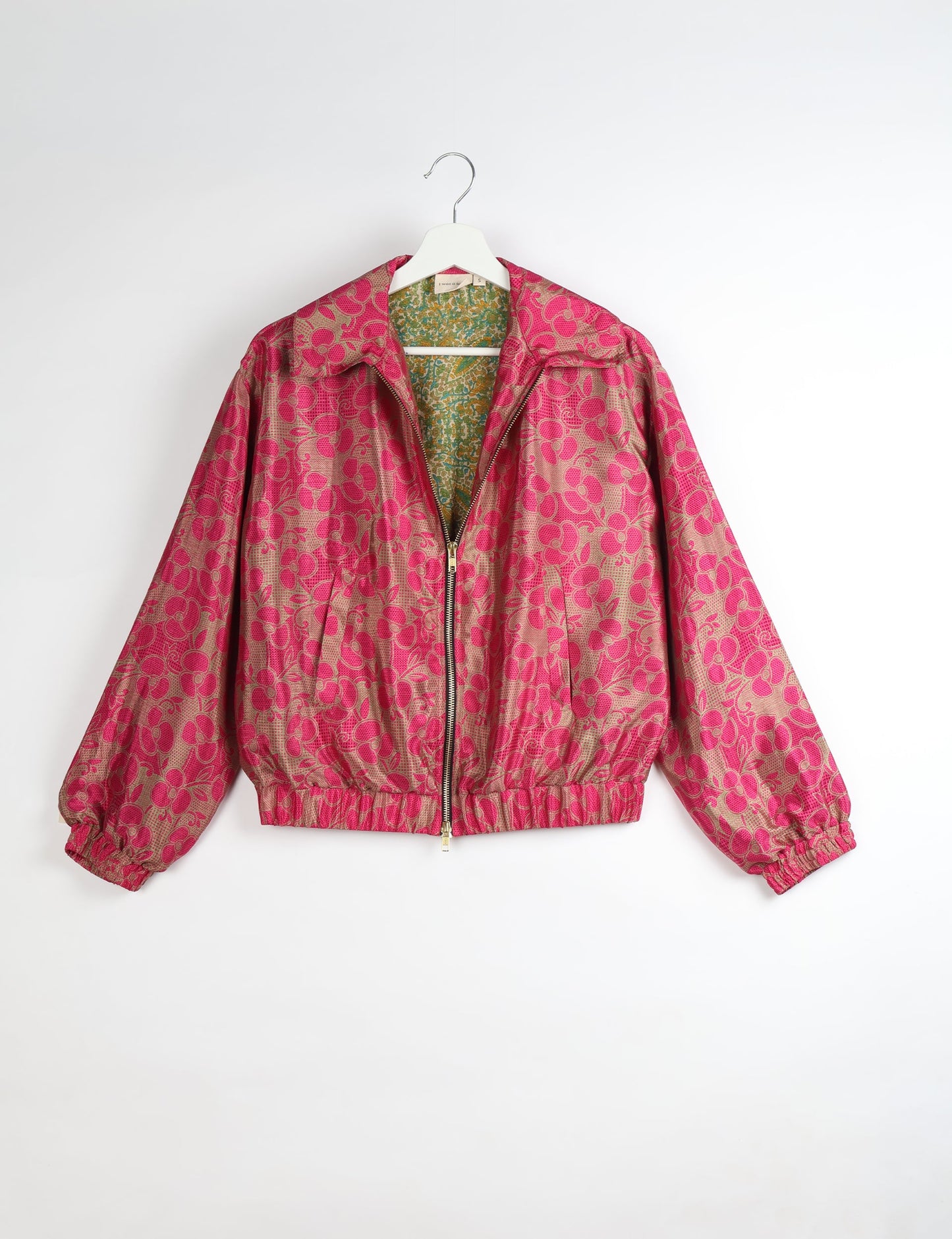 Upcycled Bomber Jacket made from recycled sari materials, featuring a cute cropped shape, elasticated hem and cuffs, and contrast sari print lining. Sustainable apparel promoting eco-friendly fashion and ethical clothing.