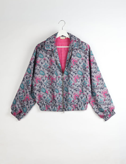 Upcycled Bomber Jacket made from recycled sari materials, featuring a cute cropped shape, elasticated hem and cuffs, and contrast sari print lining. Sustainable apparel promoting eco-friendly fashion and ethical clothing.