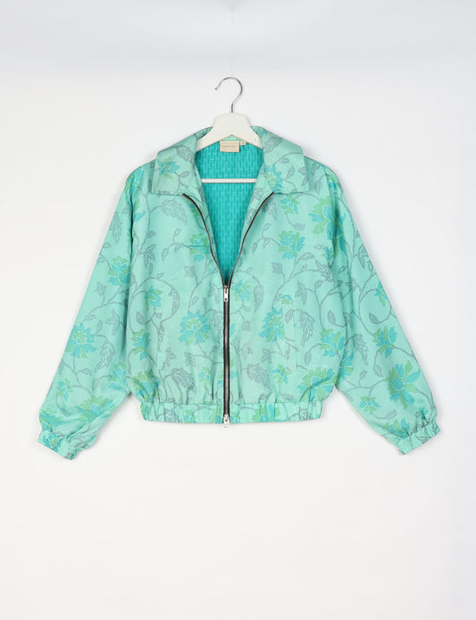 Upcycled Bomber Jacket made from recycled sari materials, featuring a cute cropped shape, elasticated hem and cuffs, and contrast sari print lining. Sustainable apparel promoting eco-friendly fashion and ethical clothing.