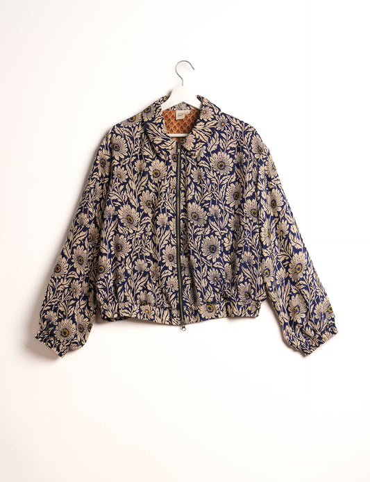 Stylish BOMBER JACKET, an upcycled clothing masterpiece with a cute cropped shape, elasticated details, and detachable metallic zipper. Contrast sari print lining adds a unique touch. Explore sustainable and eco-friendly fashion.