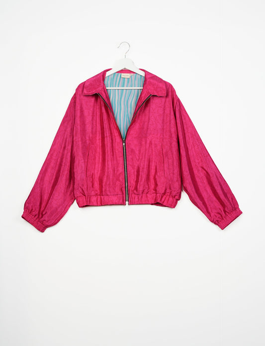 Stylish BOMBER JACKET, an upcycled clothing masterpiece with a cute cropped shape, elasticated details, and detachable metallic zipper. Contrast sari print lining adds a unique touch. Explore sustainable and eco-friendly fashion.