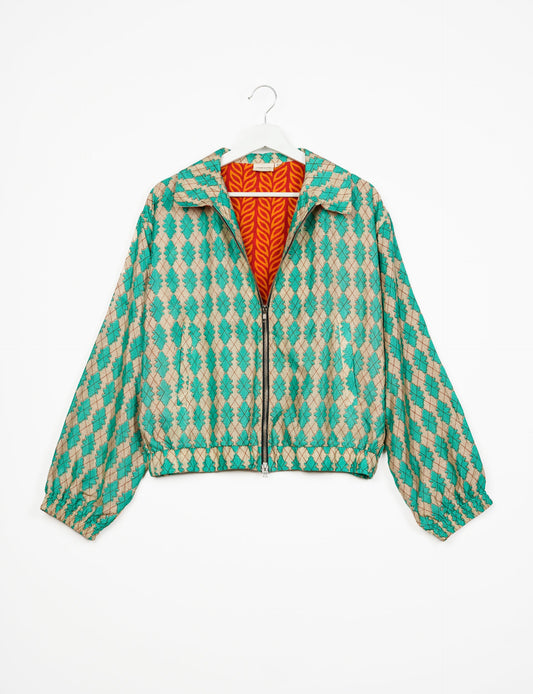 Stylish BOMBER JACKET, an upcycled clothing masterpiece with a cute cropped shape, elasticated details, and detachable metallic zipper. Contrast sari print lining adds a unique touch. Explore sustainable and eco-friendly fashion.