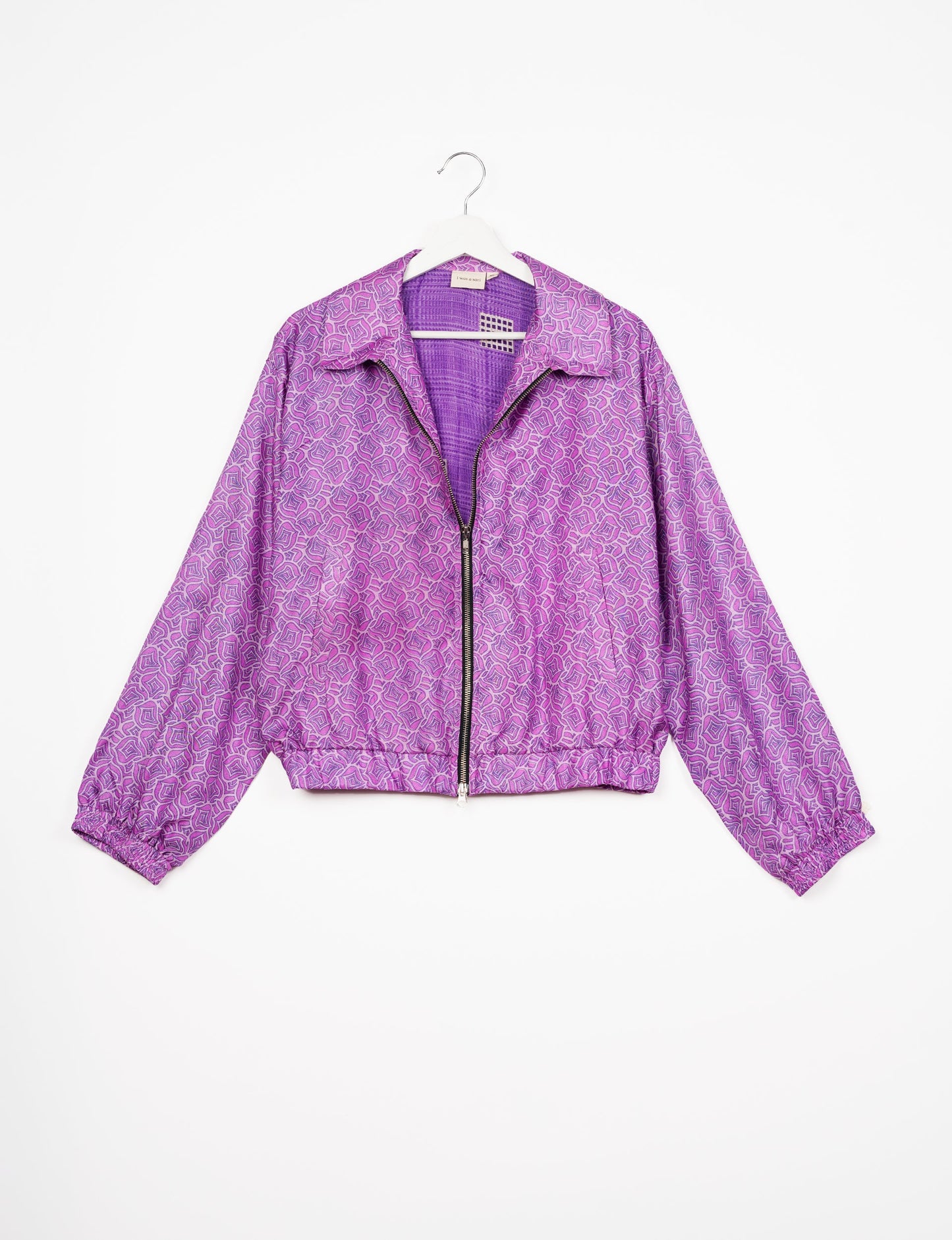 Stylish BOMBER JACKET, an upcycled clothing masterpiece with a cute cropped shape, elasticated details, and detachable metallic zipper. Contrast sari print lining adds a unique touch. Explore sustainable and eco-friendly fashion.