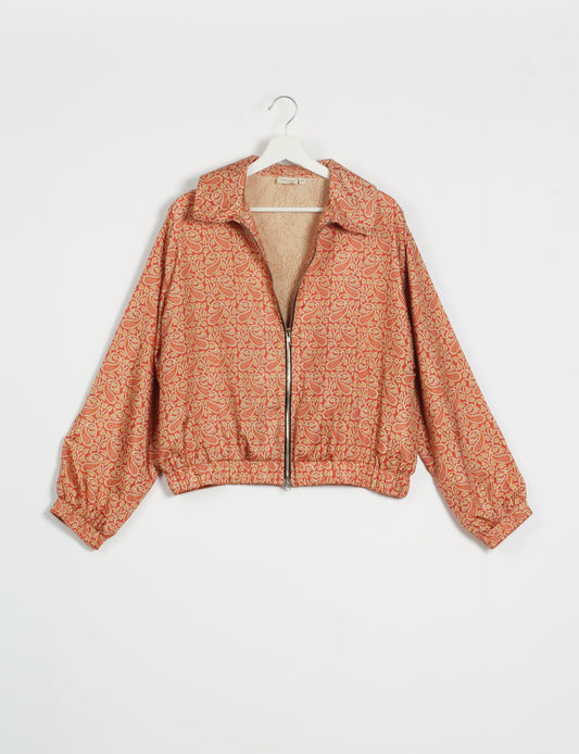 Stylish BOMBER JACKET, an upcycled clothing masterpiece with a cute cropped shape, elasticated details, and detachable metallic zipper. Contrast sari print lining adds a unique touch. Explore sustainable and eco-friendly fashion.