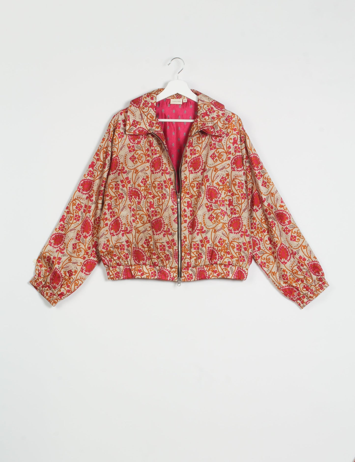 Stylish BOMBER JACKET, an upcycled clothing masterpiece with a cute cropped shape, elasticated details, and detachable metallic zipper. Contrast sari print lining adds a unique touch. Explore sustainable and eco-friendly fashion.