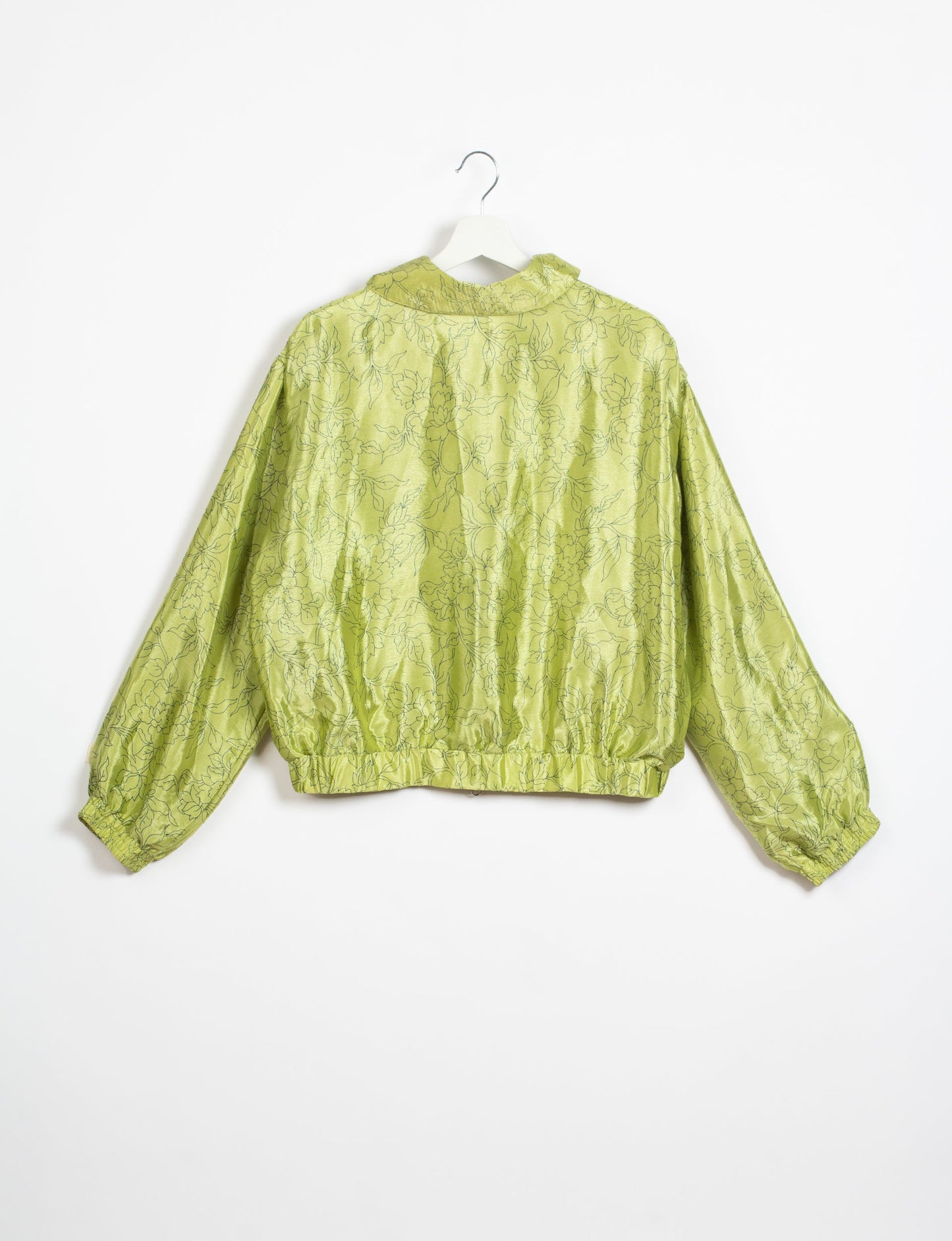 Stylish BOMBER JACKET, an upcycled clothing masterpiece with a cute cropped shape, elasticated details, and detachable metallic zipper. Contrast sari print lining adds a unique touch. Explore sustainable and eco-friendly fashion.