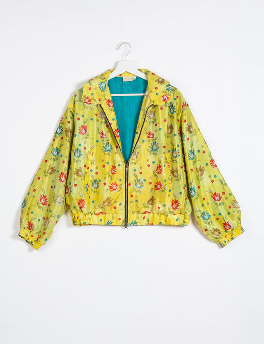 Stylish BOMBER JACKET, an upcycled clothing masterpiece with a cute cropped shape, elasticated details, and detachable metallic zipper. Contrast sari print lining adds a unique touch. Explore sustainable and eco-friendly fashion.