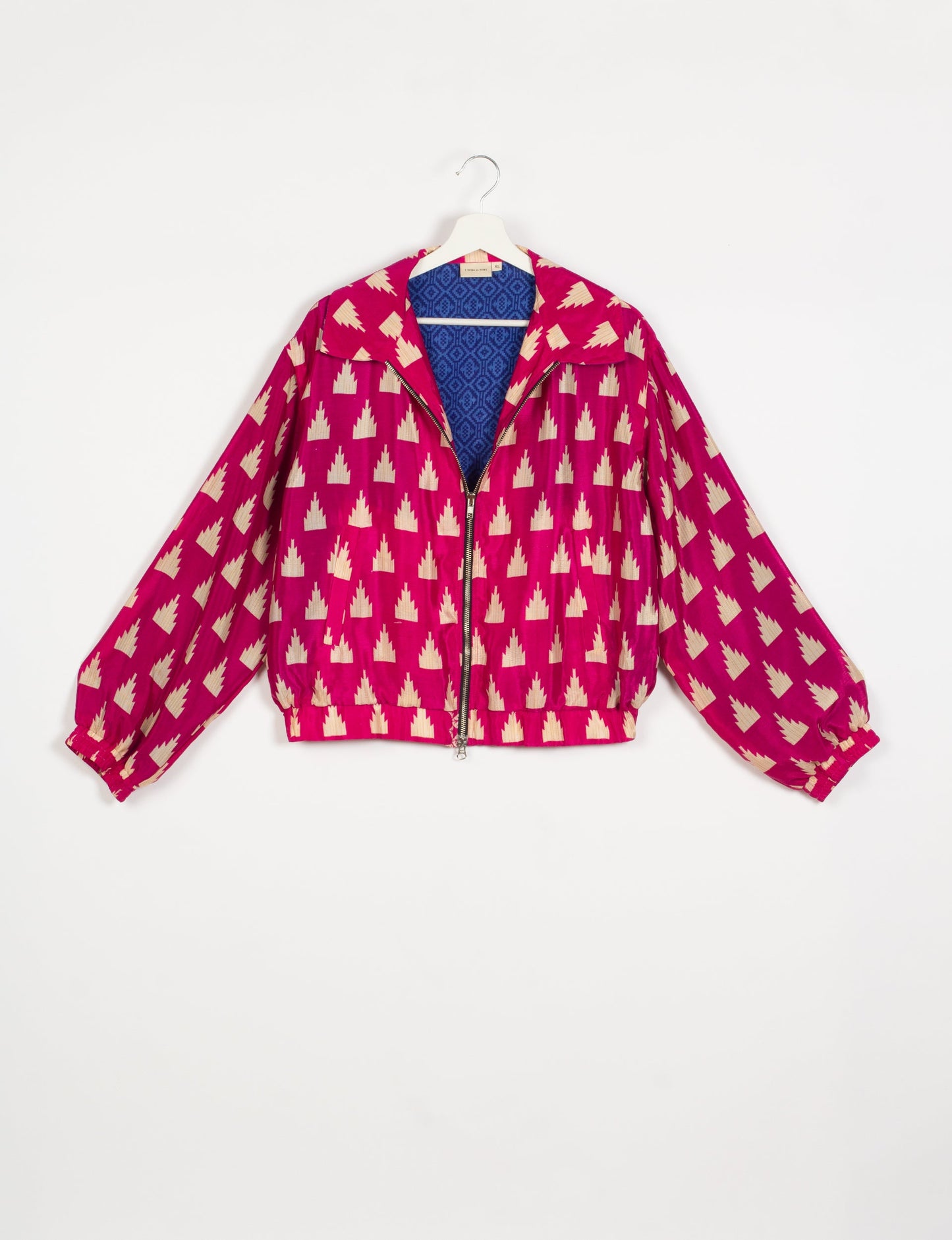 Stylish BOMBER JACKET, an upcycled clothing masterpiece with a cute cropped shape, elasticated details, and detachable metallic zipper. Contrast sari print lining adds a unique touch. Explore sustainable and eco-friendly fashion.