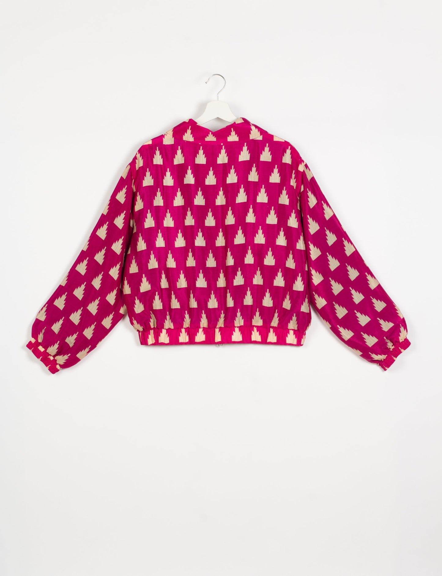 Stylish BOMBER JACKET, an upcycled clothing masterpiece with a cute cropped shape, elasticated details, and detachable metallic zipper. Contrast sari print lining adds a unique touch. Explore sustainable and eco-friendly fashion.