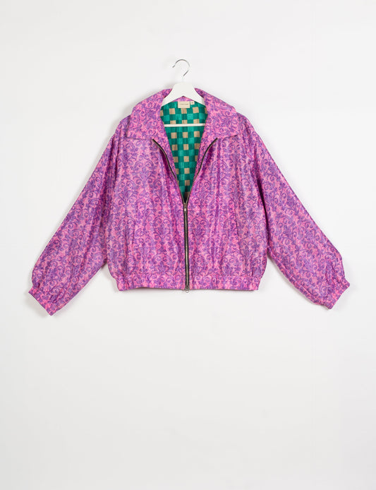 Stylish BOMBER JACKET, an upcycled clothing masterpiece with a cute cropped shape, elasticated details, and detachable metallic zipper. Contrast sari print lining adds a unique touch. Explore sustainable and eco-friendly fashion.