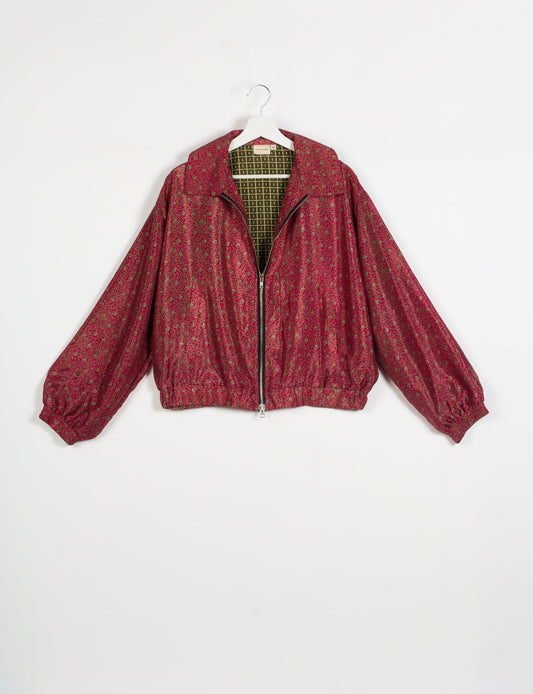 Stylish BOMBER JACKET, an upcycled clothing masterpiece with a cute cropped shape, elasticated details, and detachable metallic zipper. Contrast sari print lining adds a unique touch. Explore sustainable and eco-friendly fashion.