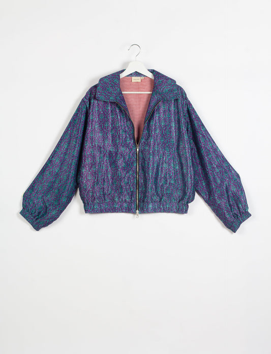 Stylish BOMBER JACKET, an upcycled clothing masterpiece with a cute cropped shape, elasticated details, and detachable metallic zipper. Contrast sari print lining adds a unique touch. Explore sustainable and eco-friendly fashion.