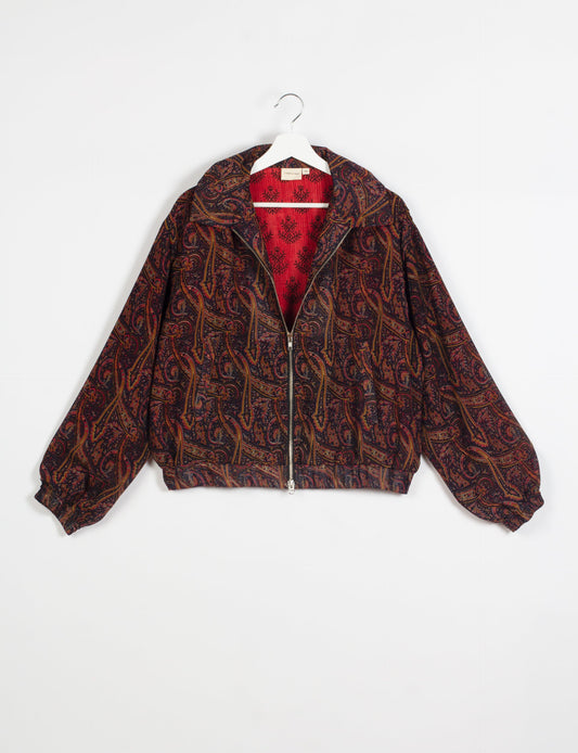 Stylish BOMBER JACKET, an upcycled clothing masterpiece with a cute cropped shape, elasticated details, and detachable metallic zipper. Contrast sari print lining adds a unique touch. Explore sustainable and eco-friendly fashion.