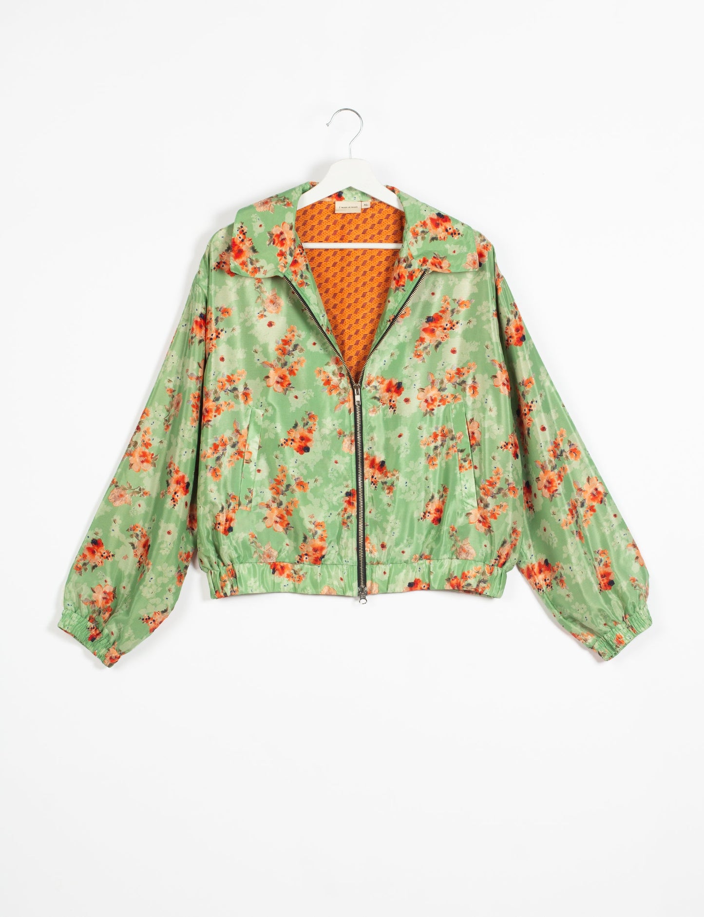 Stylish BOMBER JACKET, an upcycled clothing masterpiece with a cute cropped shape, elasticated details, and detachable metallic zipper. Contrast sari print lining adds a unique touch. Explore sustainable and eco-friendly fashion.