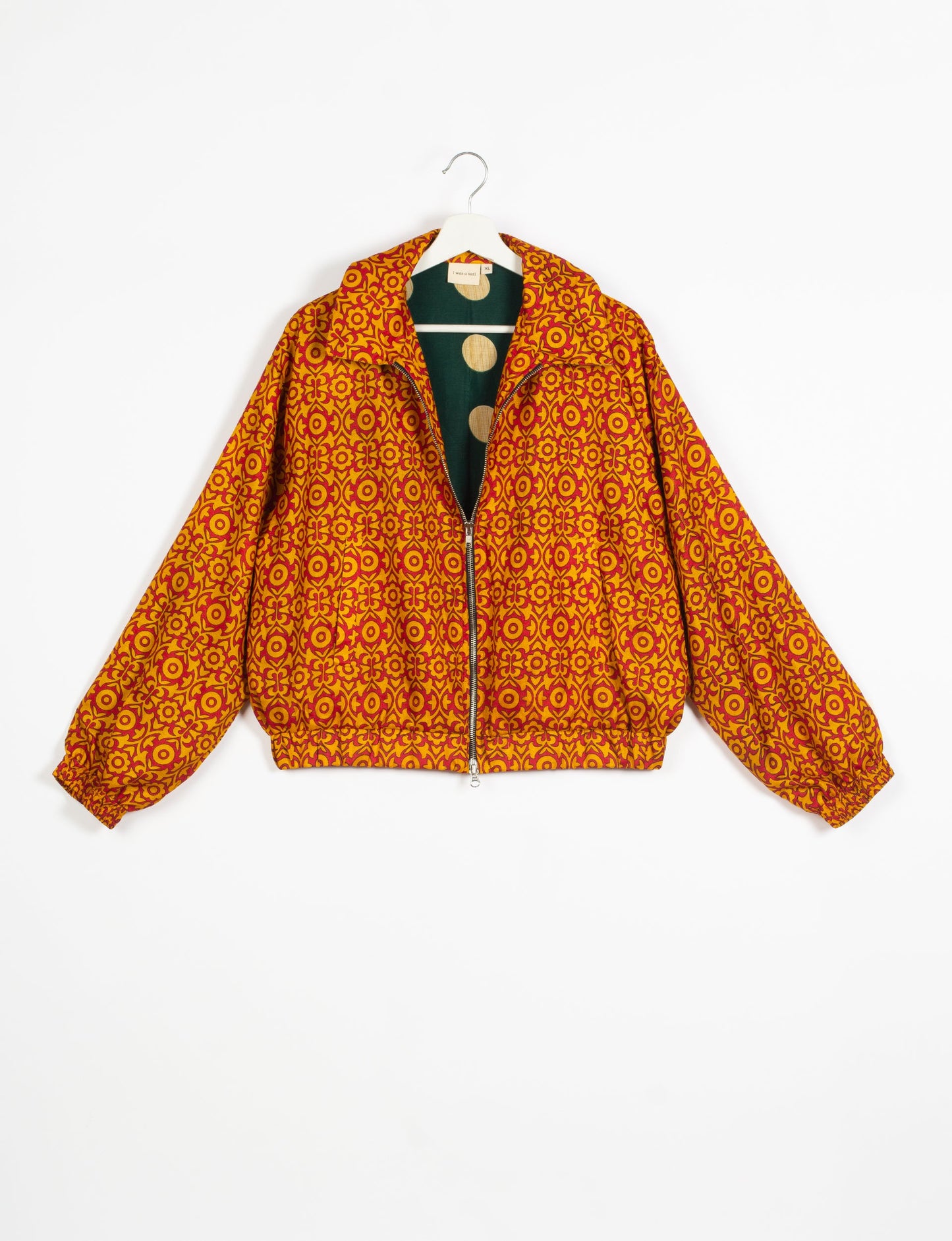 Stylish BOMBER JACKET, an upcycled clothing masterpiece with a cute cropped shape, elasticated details, and detachable metallic zipper. Contrast sari print lining adds a unique touch. Explore sustainable and eco-friendly fashion.