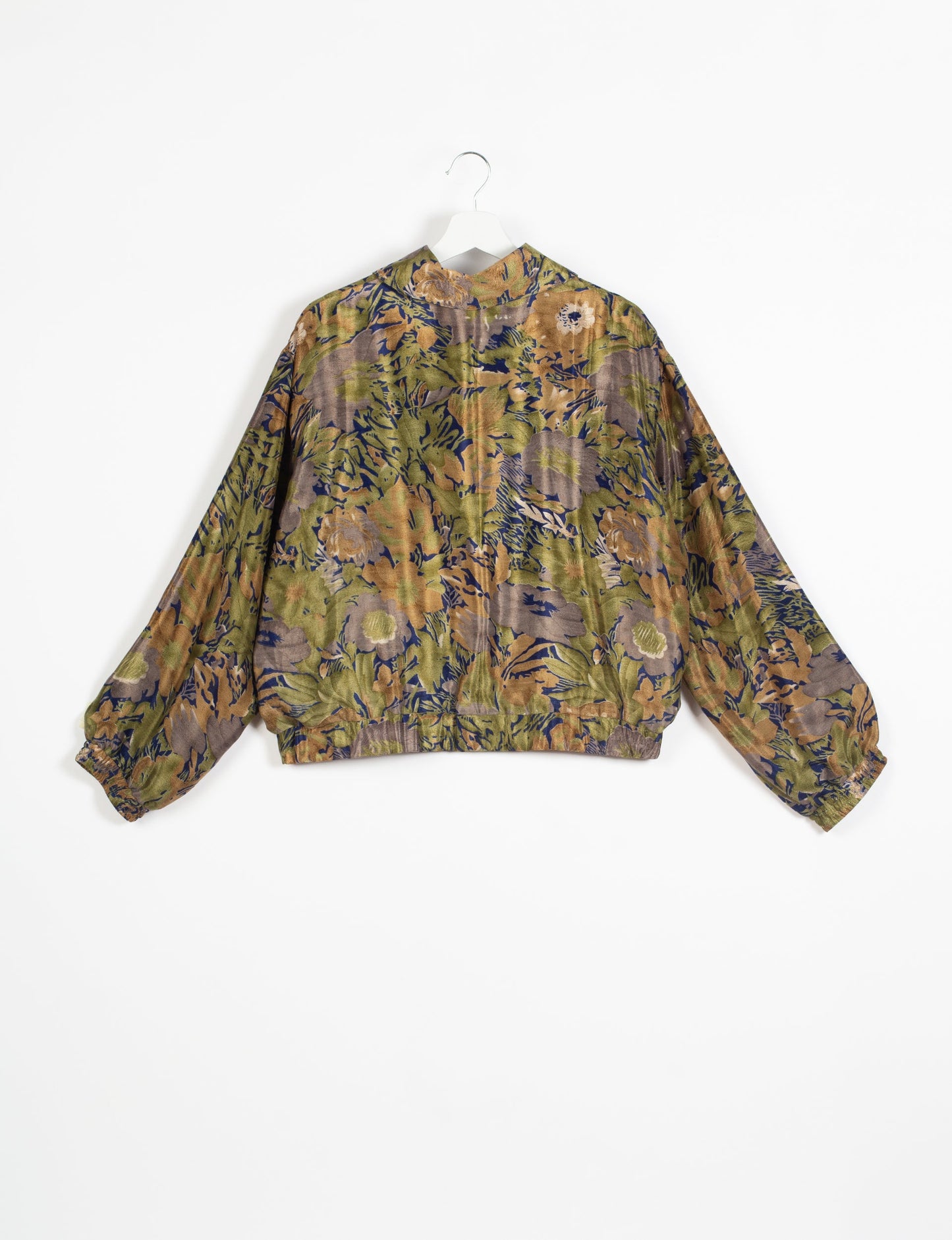 Stylish BOMBER JACKET, an upcycled clothing masterpiece with a cute cropped shape, elasticated details, and detachable metallic zipper. Contrast sari print lining adds a unique touch. Explore sustainable and eco-friendly fashion.