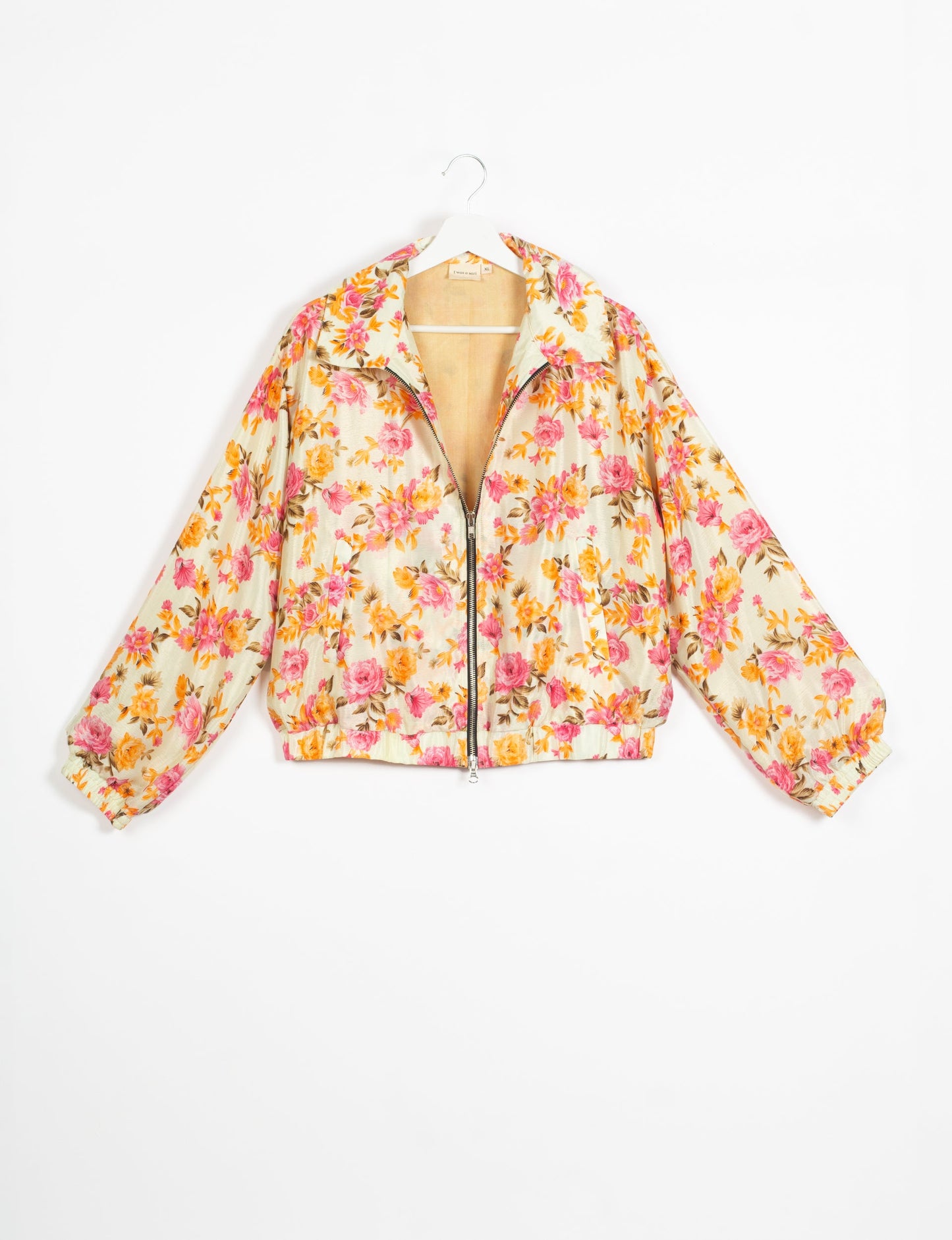 Stylish BOMBER JACKET, an upcycled clothing masterpiece with a cute cropped shape, elasticated details, and detachable metallic zipper. Contrast sari print lining adds a unique touch. Explore sustainable and eco-friendly fashion.