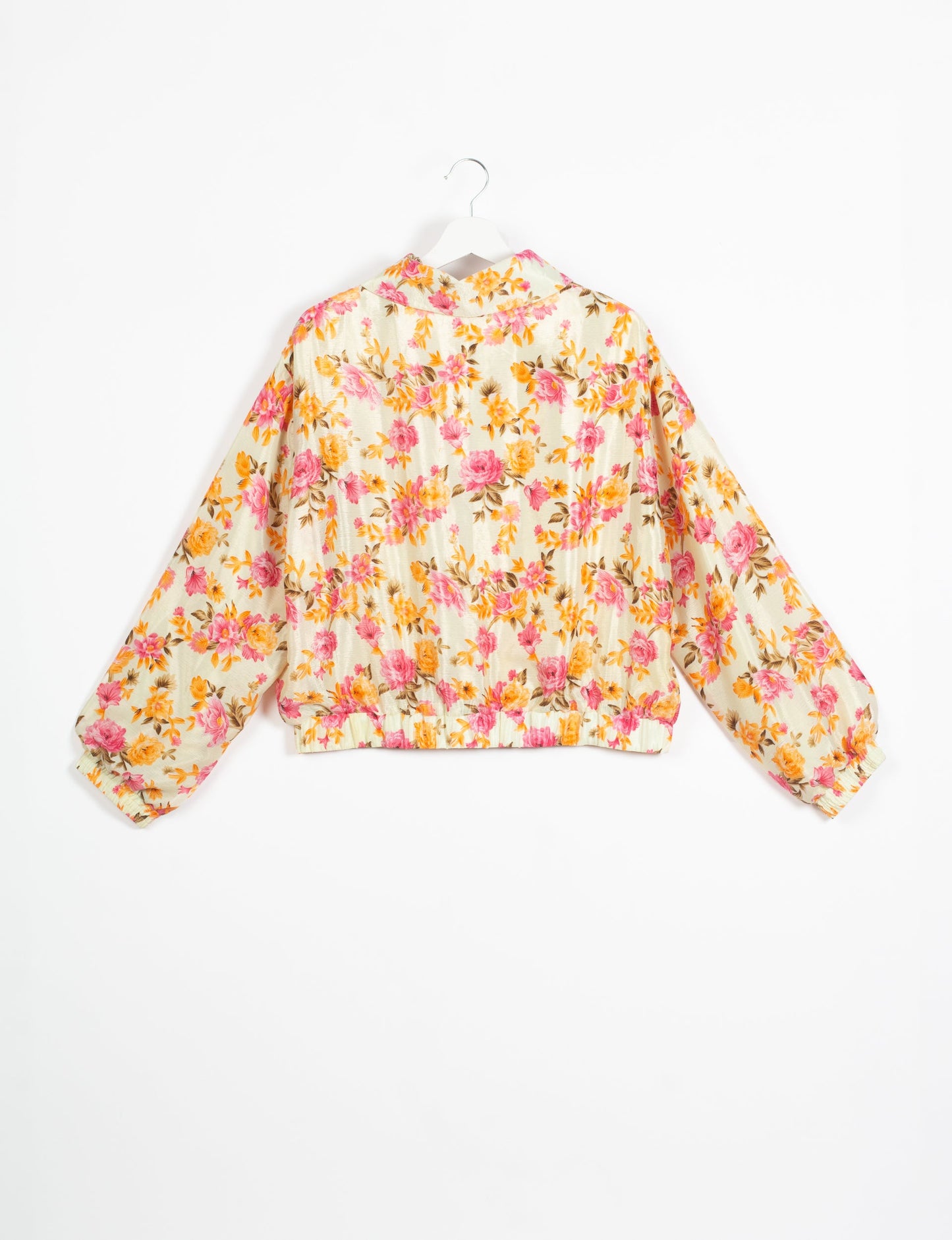 Stylish BOMBER JACKET, an upcycled clothing masterpiece with a cute cropped shape, elasticated details, and detachable metallic zipper. Contrast sari print lining adds a unique touch. Explore sustainable and eco-friendly fashion.