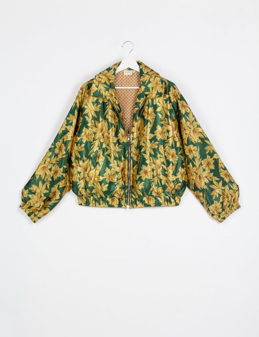 Stylish BOMBER JACKET, an upcycled clothing masterpiece with a cute cropped shape, elasticated details, and detachable metallic zipper. Contrast sari print lining adds a unique touch. Explore sustainable and eco-friendly fashion.