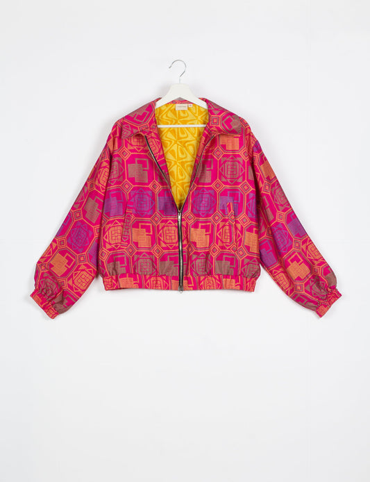 Stylish BOMBER JACKET, an upcycled clothing masterpiece with a cute cropped shape, elasticated details, and detachable metallic zipper. Contrast sari print lining adds a unique touch. Explore sustainable and eco-friendly fashion.