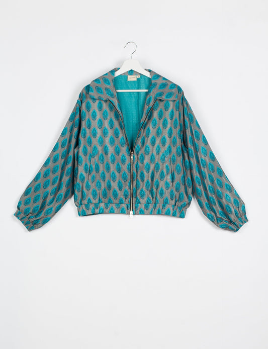 Stylish BOMBER JACKET, an upcycled clothing masterpiece with a cute cropped shape, elasticated details, and detachable metallic zipper. Contrast sari print lining adds a unique touch. Explore sustainable and eco-friendly fashion.